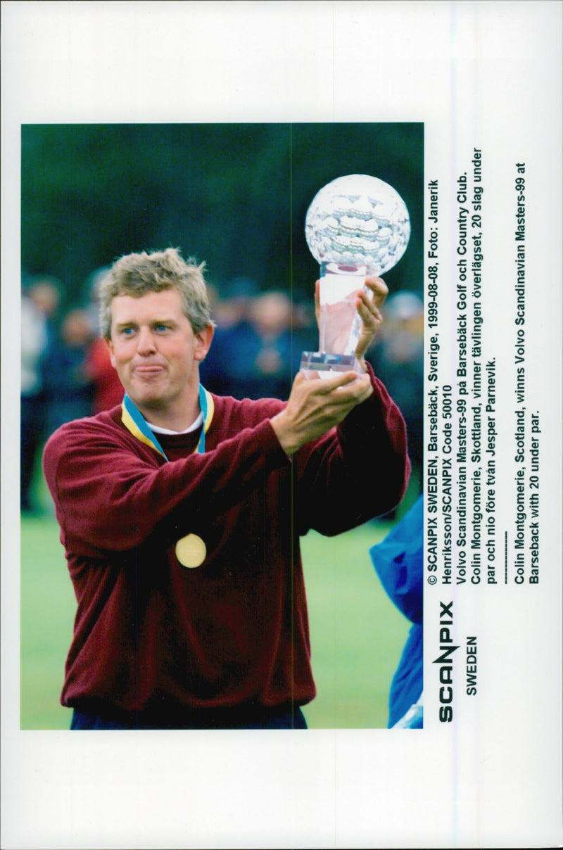 Golf player Colin Montgomerie holds up the trophy after winning the Volvo Scandinavian Masters 1999 - Vintage Photograph