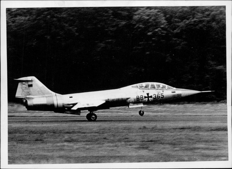 A Lockheed F-104 jet hunting plane landes at an aerodrome near Cologne after a test flight - Vintage Photograph