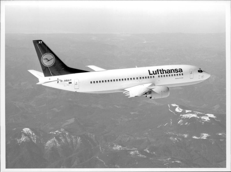 A Boeing 737-300 &quot;City Jet&quot; belonging to Lufthansa in the air. - Vintage Photograph