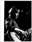 Suzanne Vega in concert. - Vintage Photograph