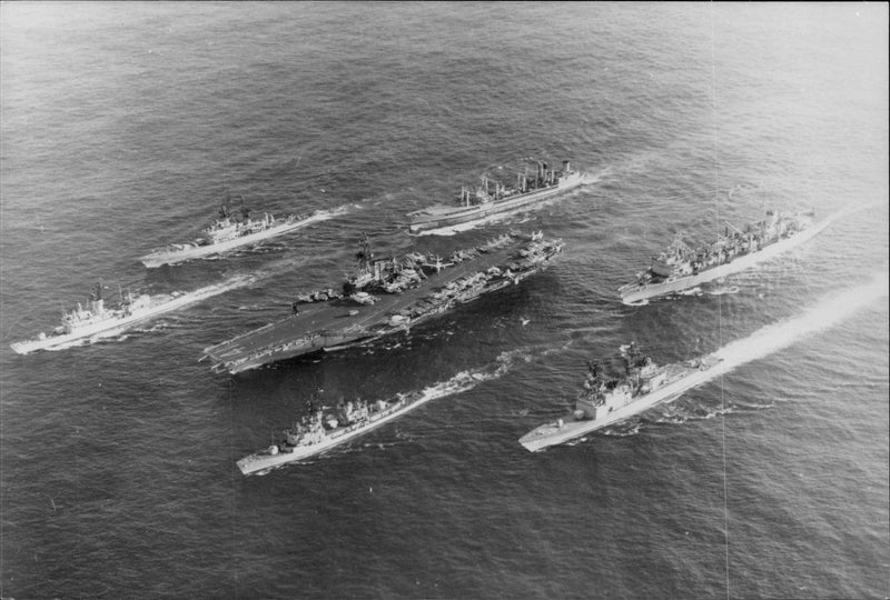 An aerial view of the USS MIDWAY aircraft carrier with Destroyer Lawrence and 3 other ships - Vintage Photograph