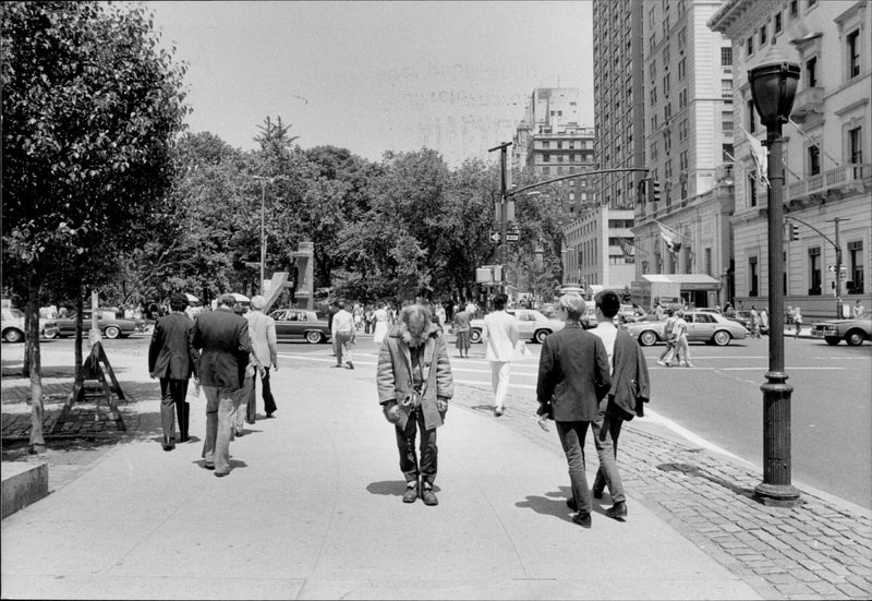 A homeless man walks on Fifth Avenue - Vintage Photograph