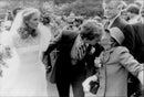 Peter McKelvy, newly married to Sydney Lawford, greets the bride&