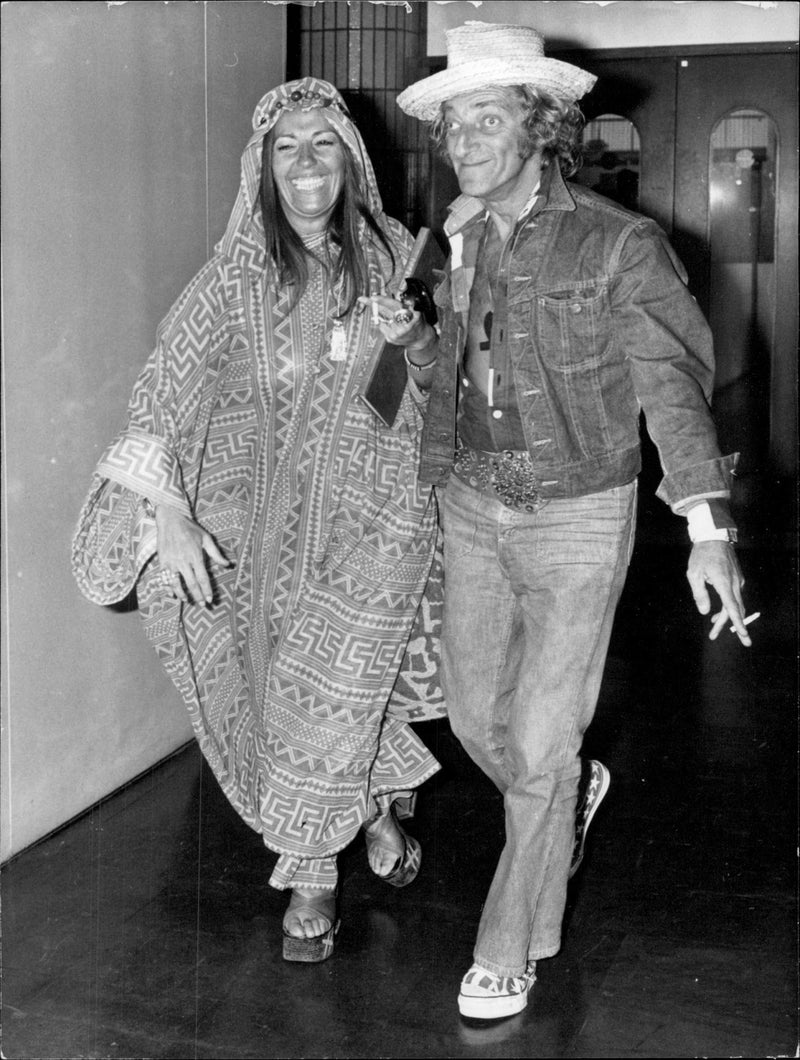 Marty Feldman and his wife Loretta Sullivan arrive at Heathrow Airport. - Vintage Photograph