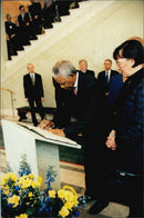 Nelson Mandela writes his signature in the Riksdag guestbook. - Vintage Photograph