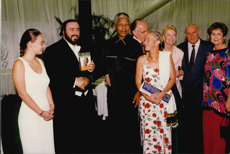 Zanele Mbeki, opera singer Luciano Pavarotti, Nelson Mandela and FW de Klerk backstage during the break at concert - Vintage Photograph