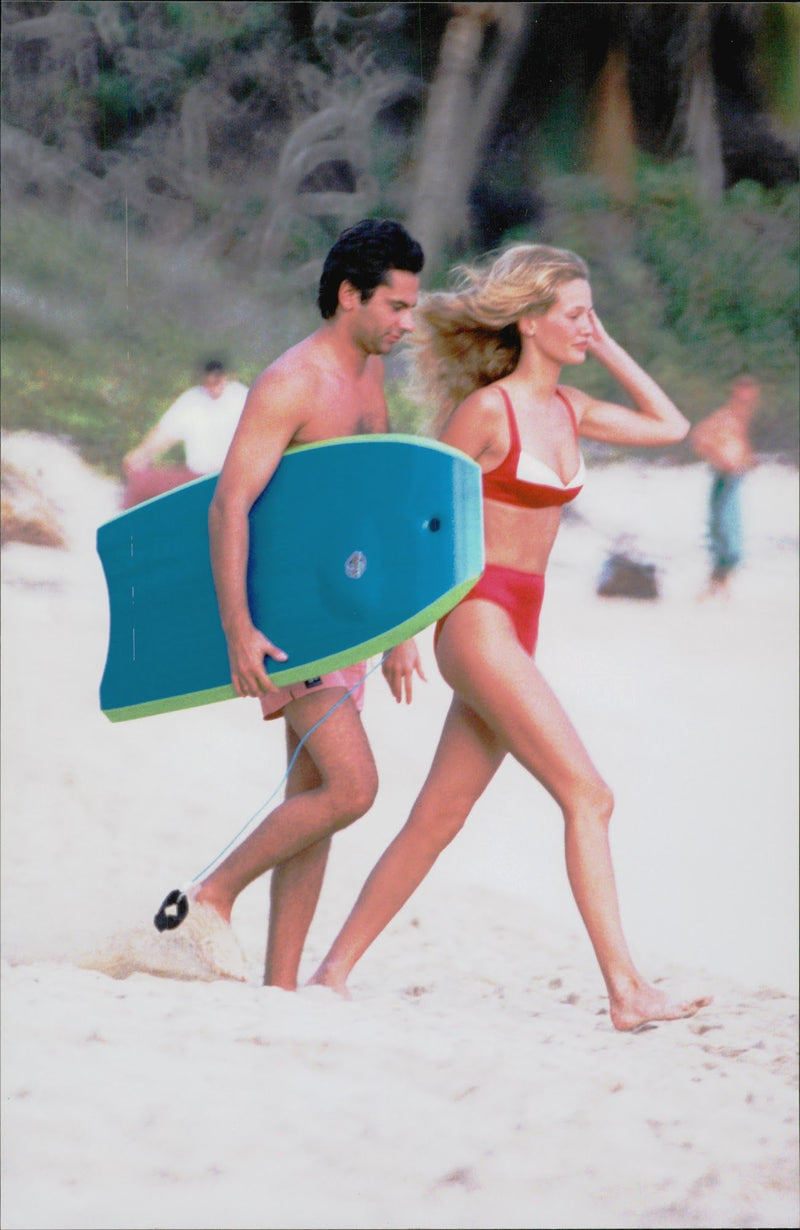 Jean-Yves Le Fur on the beach with his girlfriend, the model Karen Mul