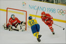 Ice hockey player at the target box during the ice hockey match SWE - BLR during the Winter Olympics in Nagano 1998 - Vintage Photograph