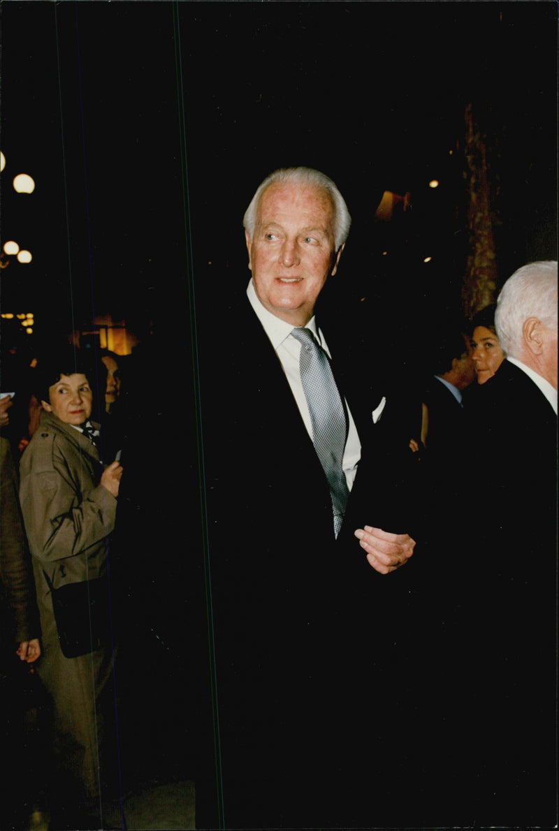 Hubert De Givenchy arrives at the concert with Mstislav Rostropovitch. - Vintage Photograph