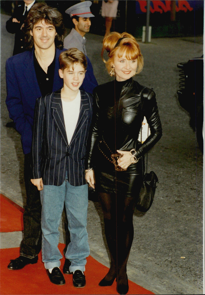 Singer Lulu with her husband John Frieda and son Jason at the premiere of the movie &quot;Dick Tracy&quot; - Vintage Photograph