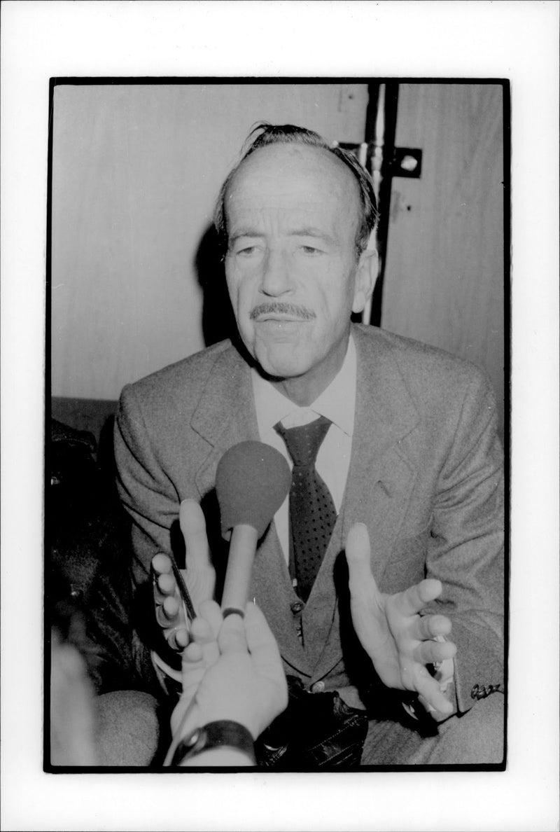 Dr Julio Iglesias Puga is waiting for his son and daughter-in-law to arrive after being held hostage by ETA terrorists. - Vintage Photograph