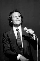 Julio Iglesias during a concert in France. - Vintage Photograph