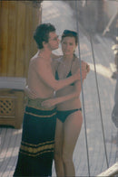 Paula Yates on the beach together with Michael Hutchence. - Vintage Photograph