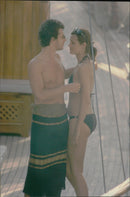Paula Yates on the beach together with Michael Hutchence. - Vintage Photograph