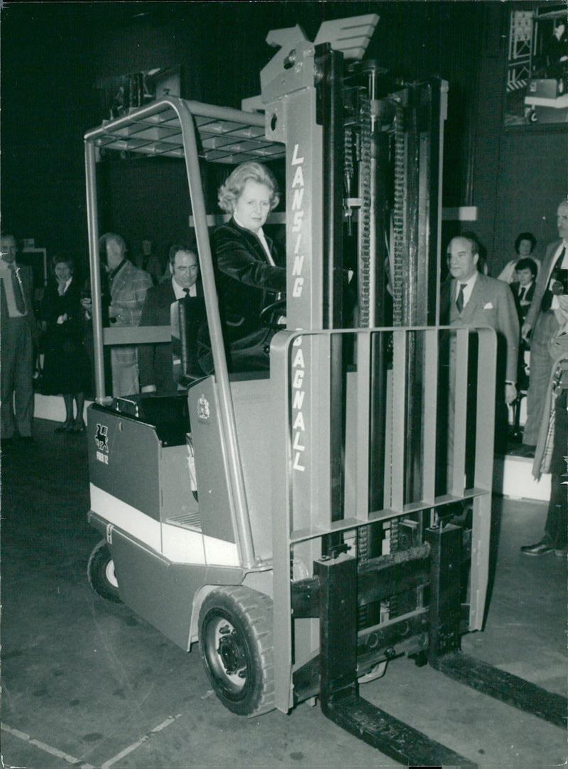 UK Prime Minister Margaret Thatcher is trying a forklift during a visit to Lansing Bagnal Ltd - Vintage Photograph