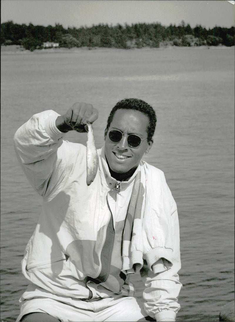 Football player Martin Dahlin holds up one of his fishing streams at Ãregrundsleden - Vintage Photograph