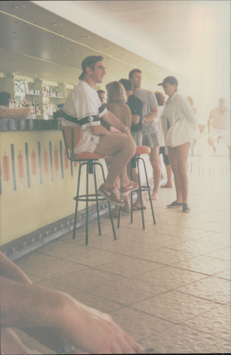 Eric Cantona on holiday in Guadeloupe with his pregnant wife Isabelle and the son of Raphael - Vintage Photograph