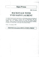 Yves Saint-Laurent together with one of the models during the premiere of the winter collection. - Vintage Photograph