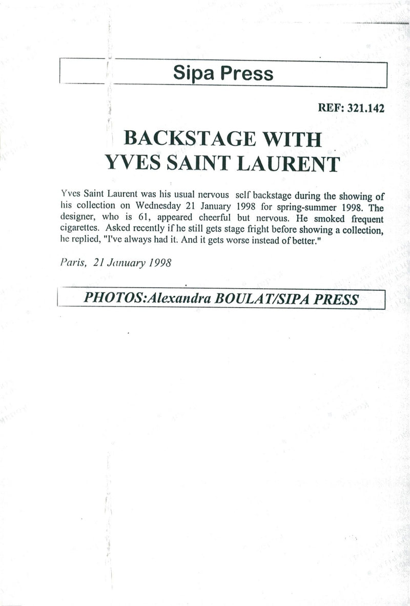 Yves Saint-Laurent together with one of the models during the premiere of the winter collection. - Vintage Photograph