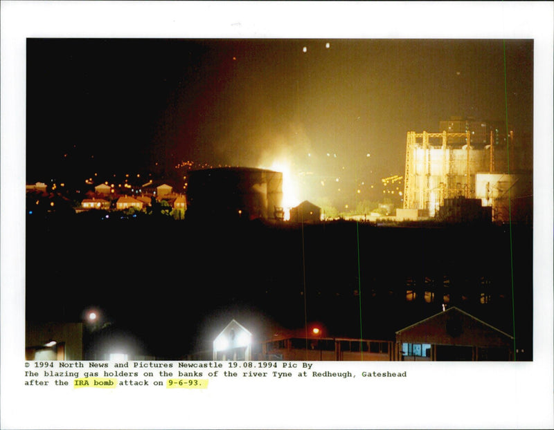 Gas tanks on fire after bomb attack. - Vintage Photograph