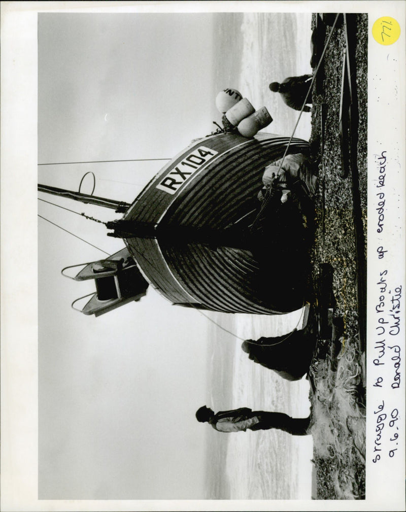 Struggle to pull up boats of croded beach. - Vintage Photograph