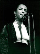 Sade, music artist, at the microphone on stage - Vintage Photograph