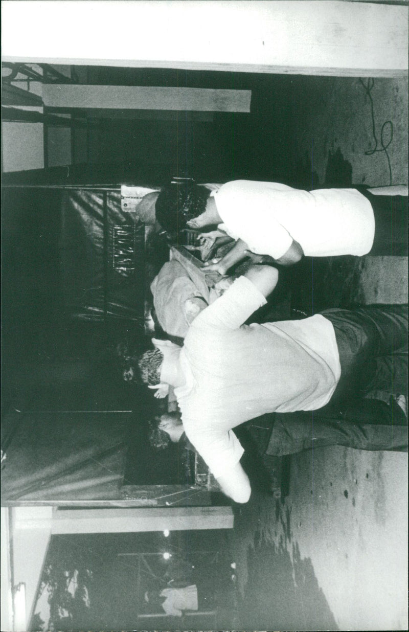 The bodies of the hanging Australians Brian Geoffrey Chambers and Kevin Barlow are being held - Vintage Photograph