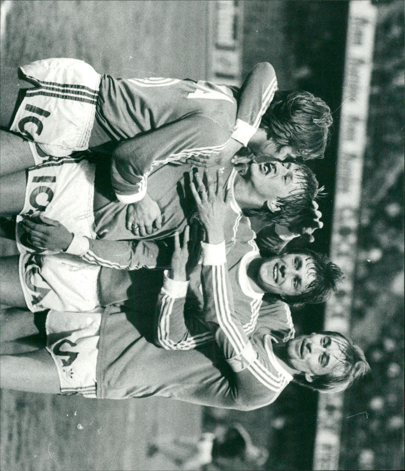 Football players in Halmstad BK hug each other on the pitch - Vintage Photograph