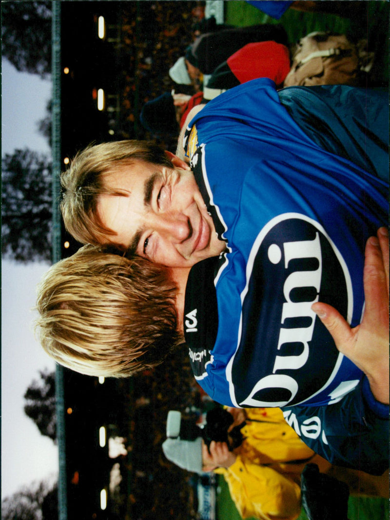 A player hugs about the coach Tom Prahl after Halmstad BK took his third SM gold after slamming Ljungskile with 3-0 in the finals in soccer SM 1997 - Vintage Photograph