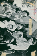 Two pictures, one showing a department of American tanks crossed by two bombers, the second picture shows a family. - 24 December 1942 - Vintage Photograph