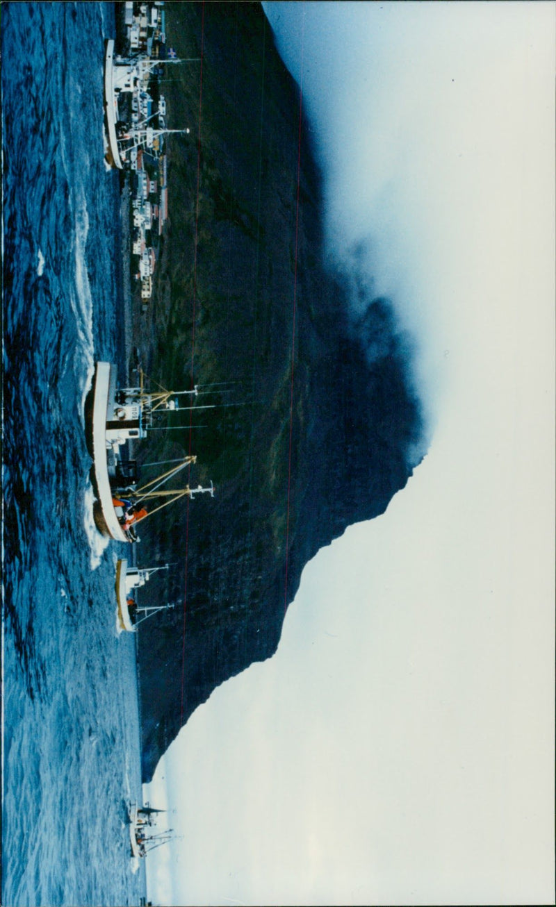 Fishing vessels heading out to sea - Vintage Photograph