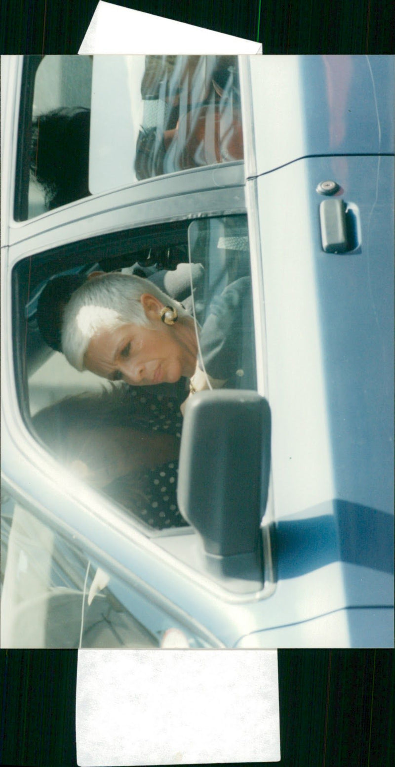 Jean Savage leaving court in a Mercedes - Vintage Photograph