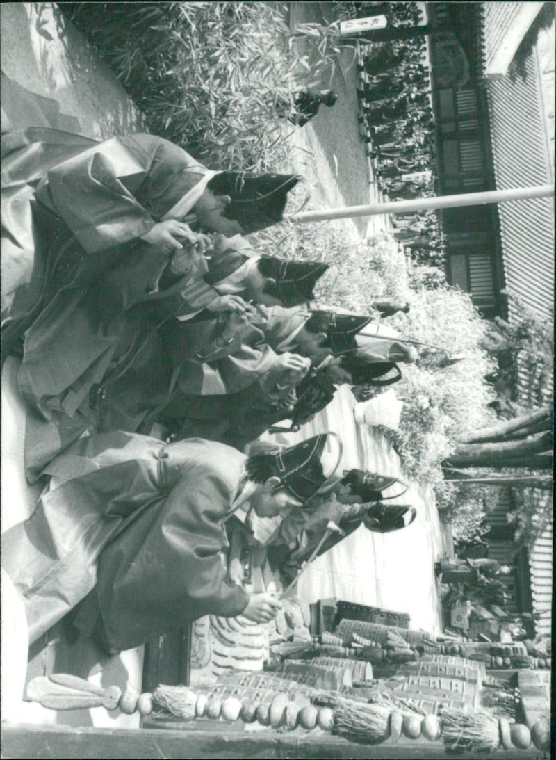 Musicians dressed suits from Yi Dynasty play ancient instruments in Seoul - Vintage Photograph