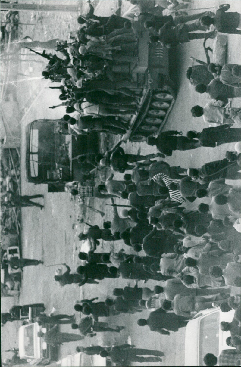 Civil rebels and soldiers take over tanks near the Doshen Tappeh Air Base - Vintage Photograph