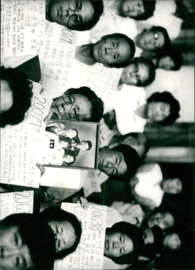 Relatives are searching for relatives who disappeared during the Korean War and World War II. - Vintage Photograph