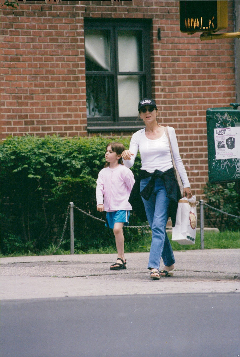 Tatum O'Neal and daughter Emily walk on the Columbus avenue - Vintage Photograph