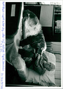 Harold Roberts with a hospital resident dog, called "Cliff". - Vintage Photograph