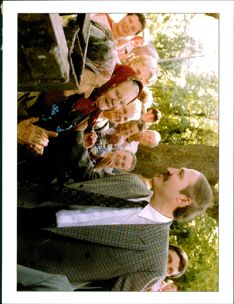 Alexander Lukashenko greets elderly Belarus villagers before entering the ballot station in Shklov. - Vintage Photograph