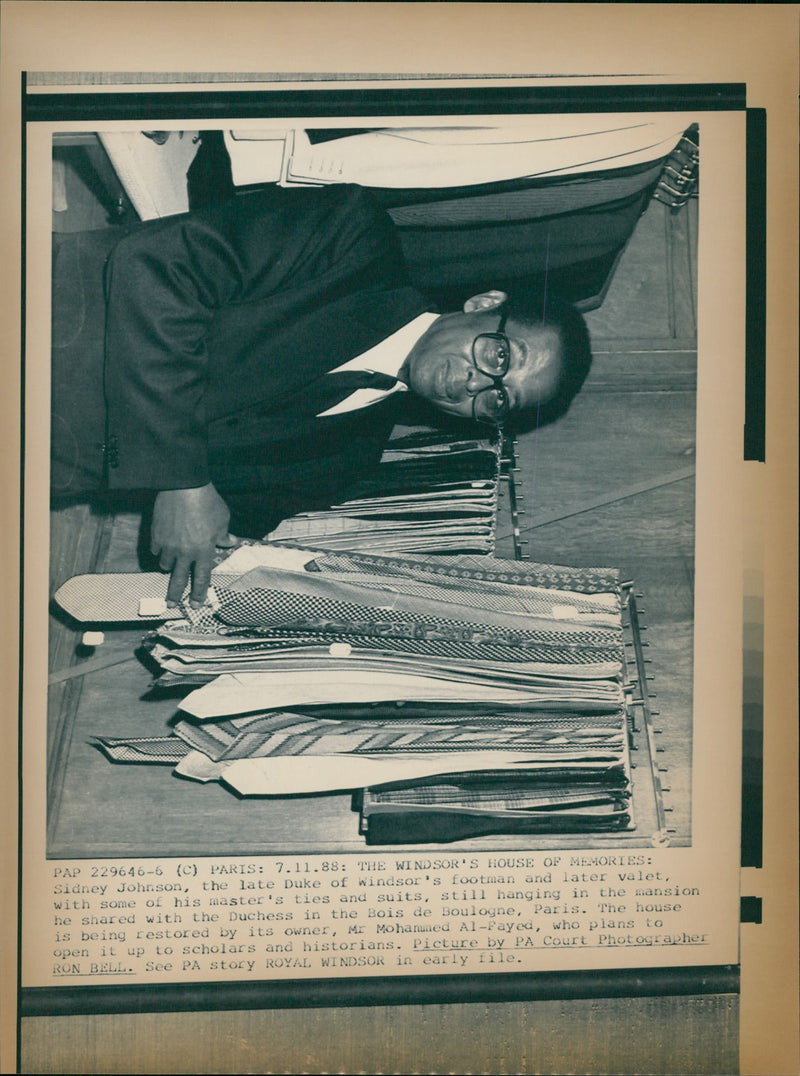 Sidney Johnson, the Duke of Windsor's footman and later valet, with some of his master's ties and suits at Bois de Boulogne - Vintage Photograph