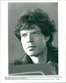 Close up of Mick Jagger as the 21st-century bounty hunter Vacendak in 1992's film "Freejack" - Vintage Photograph