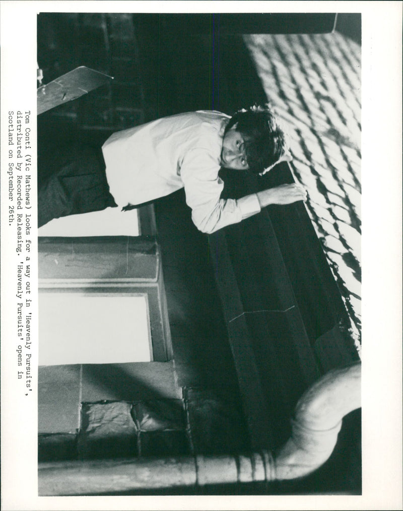 Tom Conti as Vic looks for a way out in "Heavenly Pursuits" in a scene of 1987's film "Heavenly Pursuits" - Vintage Photograph