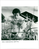 British composer and Musician Paul Hardcastle posing in a library - Vintage Photograph