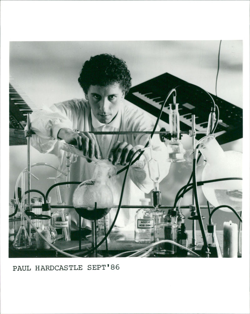 British composer and Musician Paul Hardcastle posing in a library - Vintage Photograph