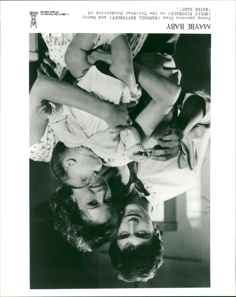Young Parents Stan (Randal Batinkoff) and Darcy (Molly Ringwald) in the Maybe Baby. - Vintage Photograph