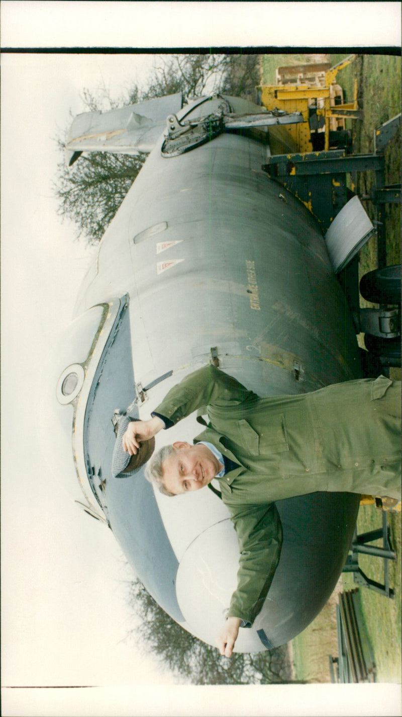 A man standing beside the jet plane. - Vintage Photograph