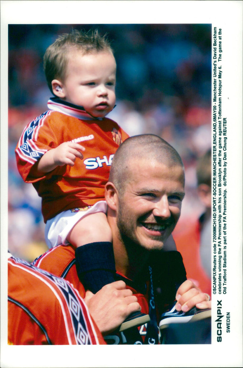 David Beckham with Brooklyn son after Manchester United has won F.A. Carling Premiership - Vintage Photograph