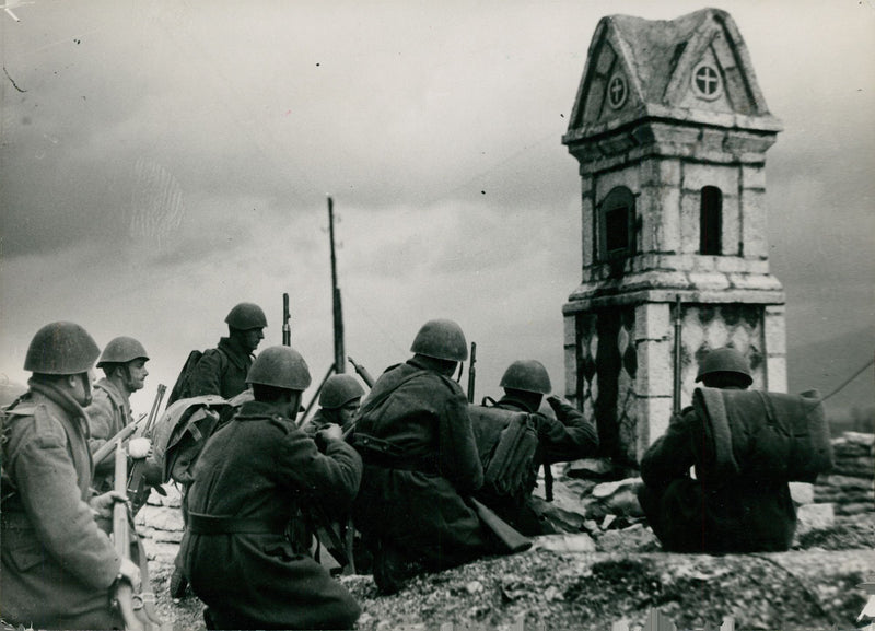 Soldiers siting while relaxing during the WWI, 1941. - Vintage Photograph