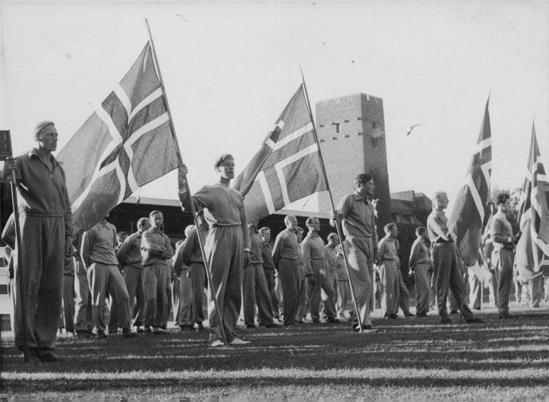 Soldiers gathered while holding the England flag during WWI,1944. - Vintage Photograph