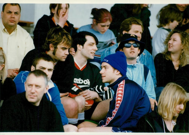 Damon Albarn in conversation with Robbie Williams - Vintage Photograph