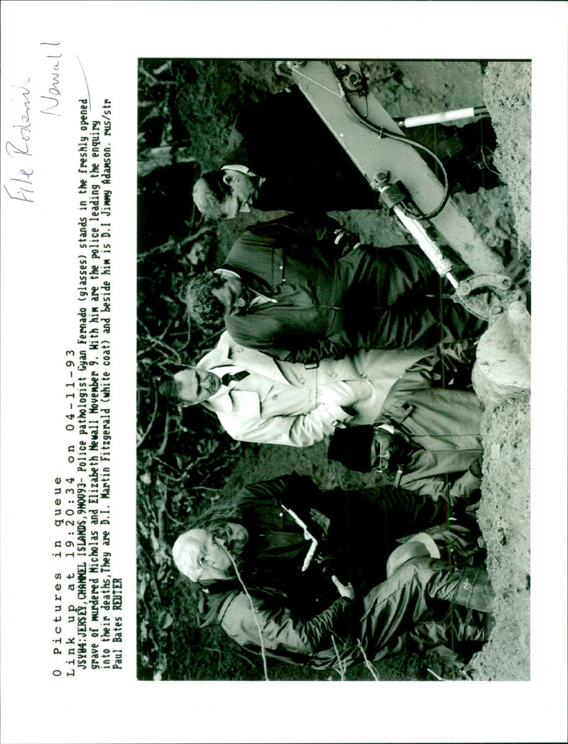 Gyan Fernado stands in the freshly opened grave of murdered Nicholas and Elizabeth Newall - Vintage Photograph